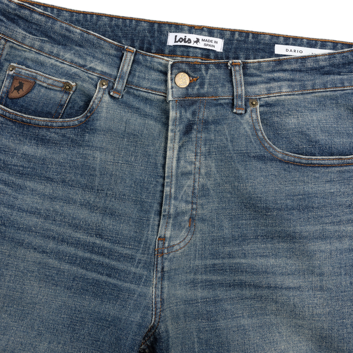 close up of waxed denim jean waistband and front pockets