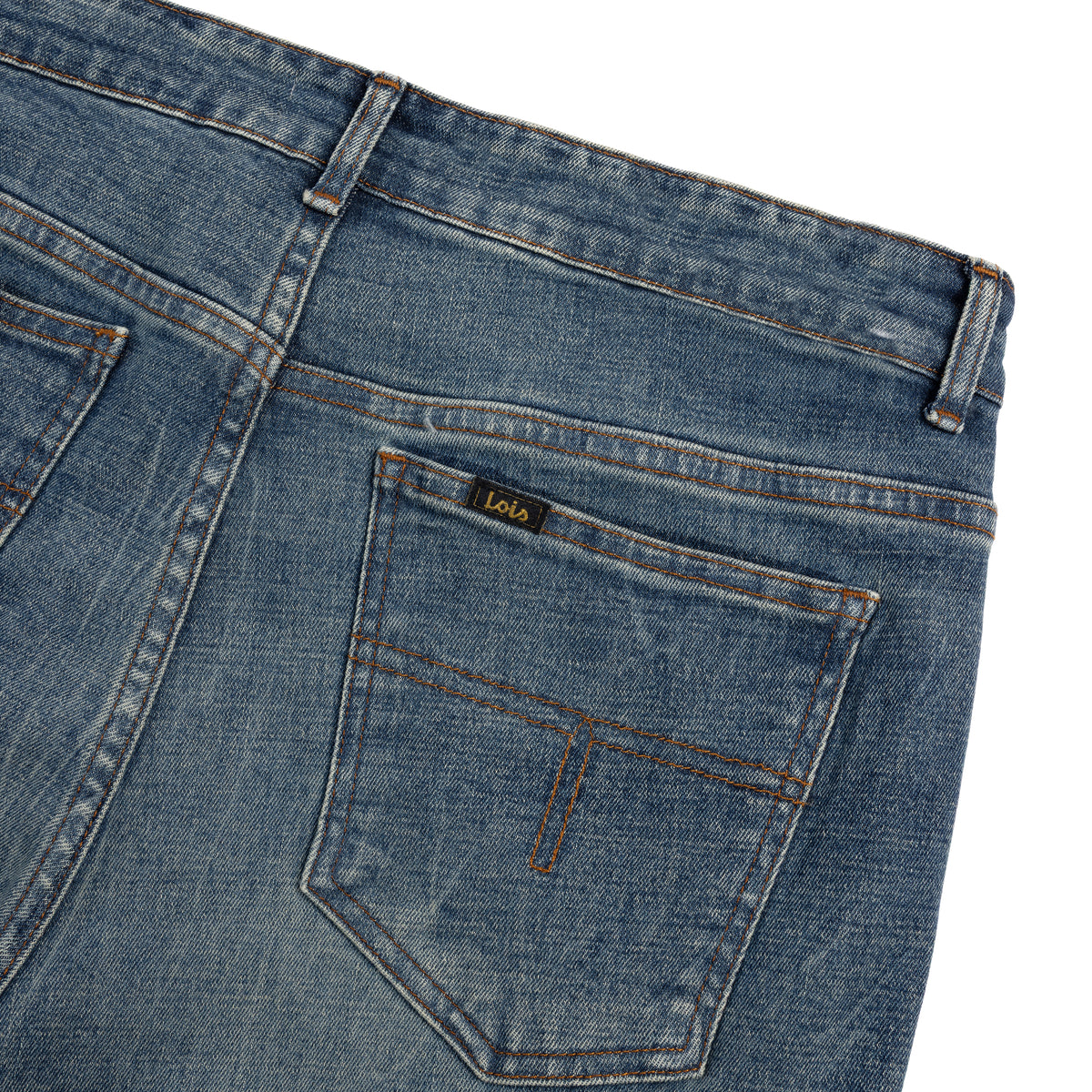 close up of washed denim jean back pockets waistband and belt loops