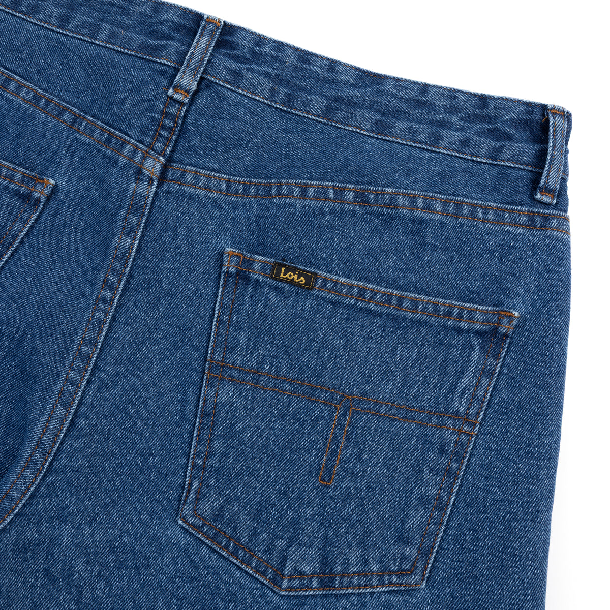 rear view close-up of blue denim jeans with a brand label on a white background