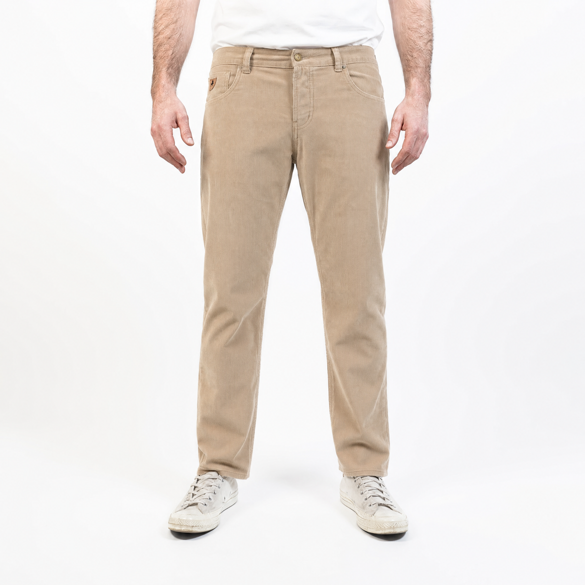Person wearing beige pants on a white background
